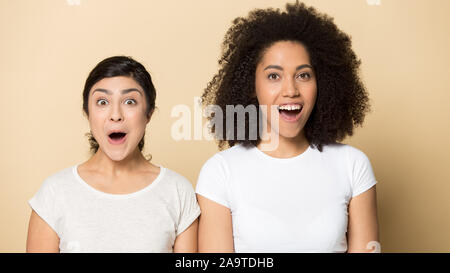Head shot portrait excited surprised diverse girls with open mouths Stock Photo