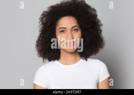 Head shot portrait beautiful African American girl looking at camera Stock Photo