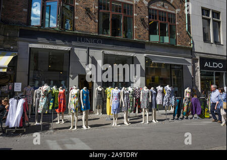 Rows of fully clothes female mannequins on display on the street outside a shop in Copenhagen, Denmark Stock Photo