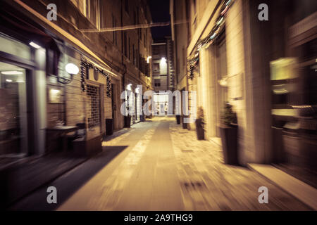 view of a street at night from a moving car Stock Photo