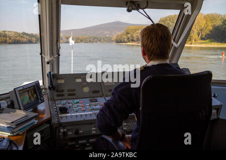 Bratislava, Slovakia. 2019/10/13. A helmsman pilots a ship on the river Danube. Stock Photo