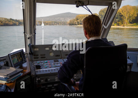 Bratislava, Slovakia. 2019/10/13. A helmsman pilots a ship on the river Danube. Stock Photo