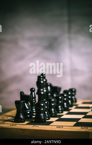 Scene of a black chess figures on a chess board Stock Photo
