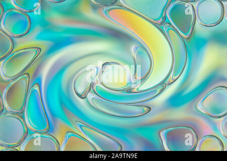 Abstract background from multi-colored distorted drops of oil on water Stock Photo