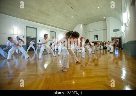 A group of students practice capoeira in a studio space at the Johns Hopkins University, Baltimore, Maryland, September 10, 2010. From the Homewood Photography Collection. () Stock Photo