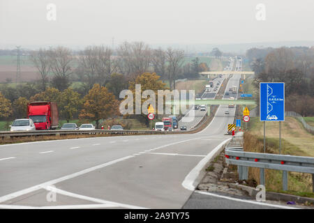 Legnickie Pole, Poland. 15th Nov, 2019. Vehicles seen on the A4 route near Legnickie Pole village.A4 highway in Poland is a 672 km long east-west motorway that runs through southern Poland, along the north side the Sudetes and Carpathian Mountains, from the Polish-German border at Zgorzelec-Gorlitz to the Polish-Ukrainian border at Korczowa-Krakovets. The motorway is a part of the European route E40. A4 is the first Polish complete border-to-border highway. The road is partially tolled, with fees being collected in toll booths across the motorway. (Credit Image: © Karol Serewis/SOPA Images Stock Photo