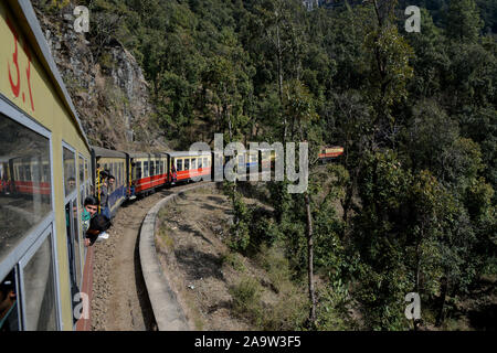 The Kalka–Shimla Railway was included in the UNESCO World Heritage List as part of the World Heritage Site Mountain Railways of India. The route from Kalka to Shimla involves journey through 103 tunnels and 864 bridges. Shimla is the capital city of the Indian state of Himachal Pradesh, located in northern India at an elevation of 7,200 ft. Due to its weather and view it attracts many tourists who arrive on the narrow gauge train. . Stock Photo