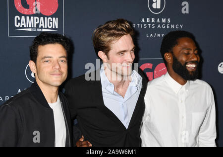 HOLLYWOOD, CA - NOVEMBER 16: (L-R) Rami Malek, Robert Pattinson and John David Washington attend the Go Campaign's 13th Annual Go Gala at NeueHouse Hollywood on November 16, 2019 in Los Angeles, California. Stock Photo