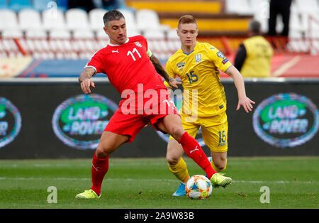 Belgrade. 17th Nov, 2019. Serbia's Aleksandar Kolarov (L) vies with Ukraine's Viktor Tsyhankov during the group B match between Serbia and Ukraine at the UEFA Euro 2020 qualifier in Belgrade, Serbia on Nov. 17, 2019. Credit: Predrag Milosavljevic/Xinhua/Alamy Live News Stock Photo