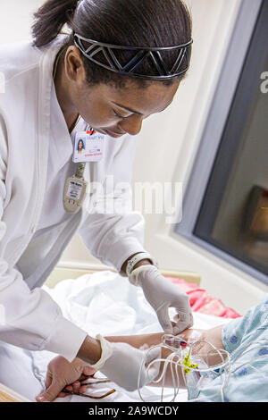 Miami Beach Florida,Mt. Mount Sinai Medical Center,hospital,healthcare,patient private room,Black female,woman female women,nurse,patient,FL100207023 Stock Photo