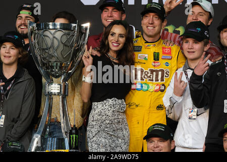 Homestead, United States. 17th Nov, 2019. Kyle Busch celebrates with his wife Samantha his second Monster Energy NASCAR Cup Series championship Sunday at the NASCAR Ford EcoBoost 400 Cup Series Championship at Homestead-Miami Speedway in Homestead, Florida, November 17, 2019. This is the last championship race to be held at the Homestead-Miami Speedway. Next season the championship will move to Phoenix, Arizona. Photo By Gary I Rothstein/UPI Credit: UPI/Alamy Live News Stock Photo