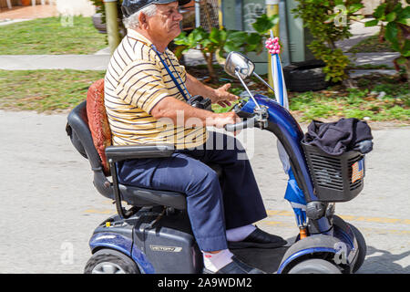 Miami Beach Florida,senior seniors old citizen citizens pensioner pensioners retired elderly,adult adults man men male,electric wheelchair,scooter sco Stock Photo