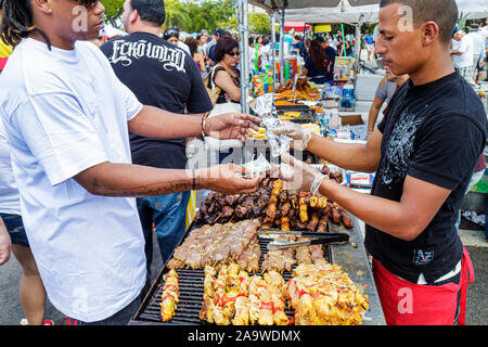 Miami Florida,Little Havana,Calle Ocho,Carnaval Miami,annual Hispanic festival,Black man men male,cook,food,vendor vendors stall stalls booth market m