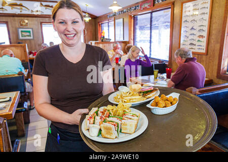 Florida The Everglades,Everglades City,waitress server employee worker workers working staff,serving food,tray,service,FL100322024 Stock Photo