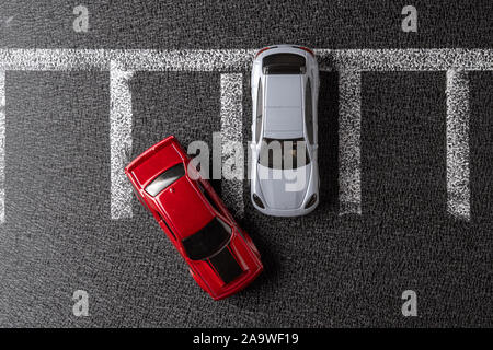 Two toy cars in the parking lot. Top view Stock Photo