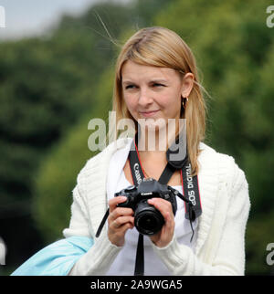 Russian female blonde photographer. Gorky Park, Moscow, Russia Stock