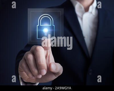 cyber network security concept., Businessman pressing lock icon Stock Photo
