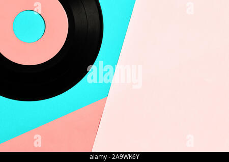 Vinyl record on pastel blue and pink background. Overhead view with geometric shapes with copy space. Stock Photo