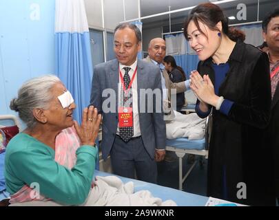 Kathmandu, Nepal. 17th Nov, 2019. Chinese Ambassador to Nepal Hou Yanqi (R) visits a patient who received a cataract surgery at Manmohan Memorial Hospital in Kathmandu, Nepal, Nov. 17, 2019. Chinese medical team have provided free cataract surgeries to over 50 Nepali patients in the last two days here as part of the programs to strengthen medical cooperations between the two countries. Credit: Sunil Sharma/Xinhua/Alamy Live News Stock Photo