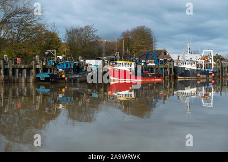 Fishing boats moored on the River Rother at Rye in East Sussex, England Stock Photo