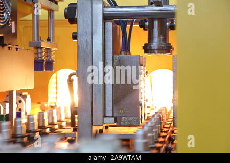 Plastic bottle injection mould set in machine ; preparing for production ; industrial manufacturing equipment background Stock Photo