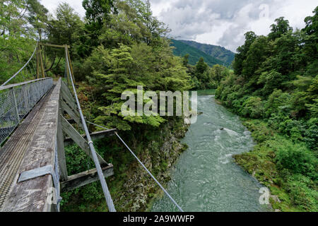 Rai river swing bridge over the Rai river below, at Pelorus, Marlborough, New Zealand. Stock Photo