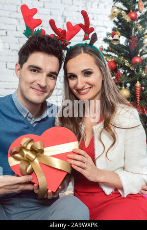 Woman and man in love with presents for Christmas Stock Photo