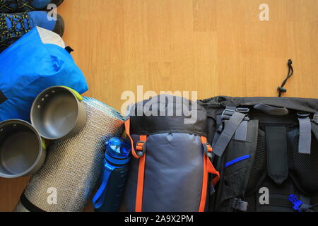 Flat lay composition with camping equipment on wooden background Stock Photo
