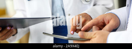 Two doctors looking in tablet pc display Stock Photo