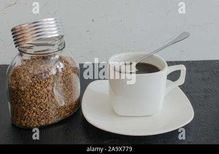 Instant coffee in a glass jar with blank label isolated on white