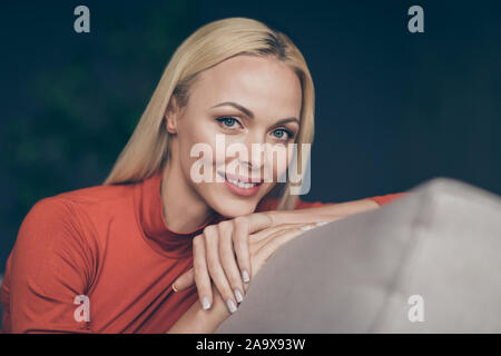 Closeup photo of pretty lady domestic mood overjoyed relaxation Saturday morning sitting comfy couch casual outfit living room indoors Stock Photo