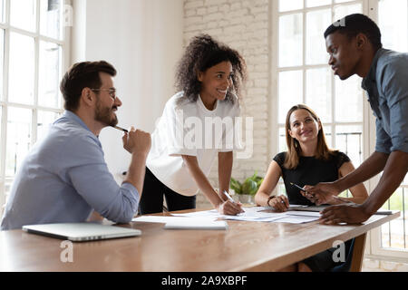 Skilled biracial professional proposing good problem solution. Stock Photo