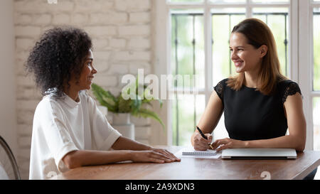 HR manager holding job interview with skilled african ethnicity woman. Stock Photo