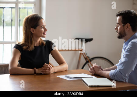 Pleasant young business woman meeting skilled professional lawyer. Stock Photo