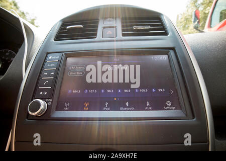 touch screen radio controls with lens flare in a compact car in florida usa Stock Photo