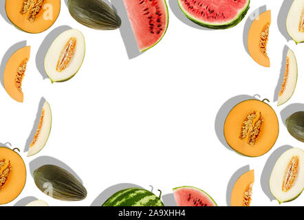 Sweet melons of different varieties and watermelon, whole, halves and slices, isolated on white with copy space for text or images. Sappy flesh with s Stock Photo