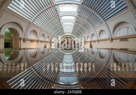 Passageway with reflection. Amazing architecture. Stock Photo