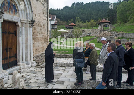Gradac Monastery, Serbia, May 04, 2019. A group of tourists expects to enter the monastery, which was erected in the second half of the 13th century ( Stock Photo
