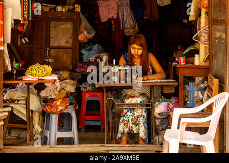 A Young Woman Working In A Traditional Workshop, Mandalay, Myanmar. Stock Photo