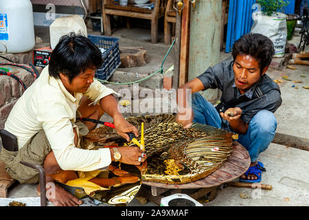 Two Burmese Men Working In A Workshop, Mandalay, Myanmar. Stock Photo