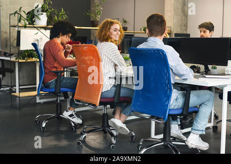 Group of young people working on computers at office Stock Photo