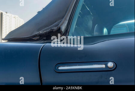 Car door with handle, black car door, oregrinal door handle, torn roof Stock Photo