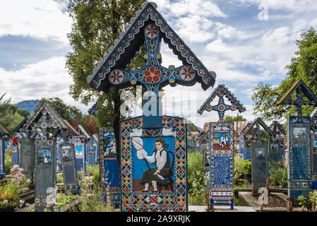 Traditional folk graves on Cimitirul Vesel - Merry Cemetery, famous cemetery in the village of Sapanta, located in Maramures county, Romania Stock Photo