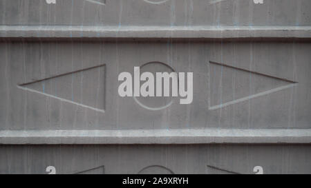 Texture of triangles and circle on a concrete slab Stock Photo