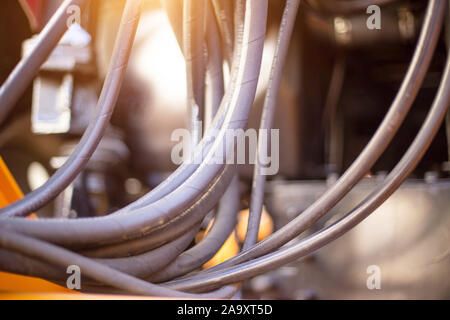 Many high pressure hydraulic hoses that drive excavator buckets, industry, background, copy space Stock Photo