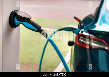 Electric vehicle charging station point, closeup of unit plug Stock Photo