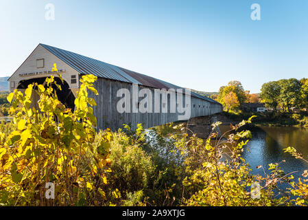 Historic covered bridge spanning the Connecticut River between Cornish, NH, and Windsor on a sunny autumn day Stock Photo