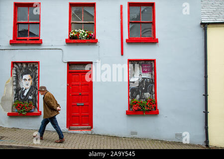 Irish man walking up street in Cathedral Quarter Letterkenny County Donegal Republic of Ireland Stock Photo