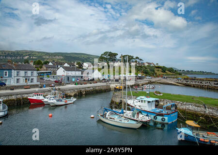 Carnlough is a village in County Antrim, Northern Ireland. It has a picturesque harbour on the shores of Carnlough Bay. Carnlough is on the Coast Road Stock Photo