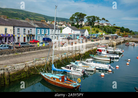 Carnlough is a village in County Antrim, Northern Ireland. It has a picturesque harbour on the shores of Carnlough Bay. Carnlough is on the Coast Road Stock Photo